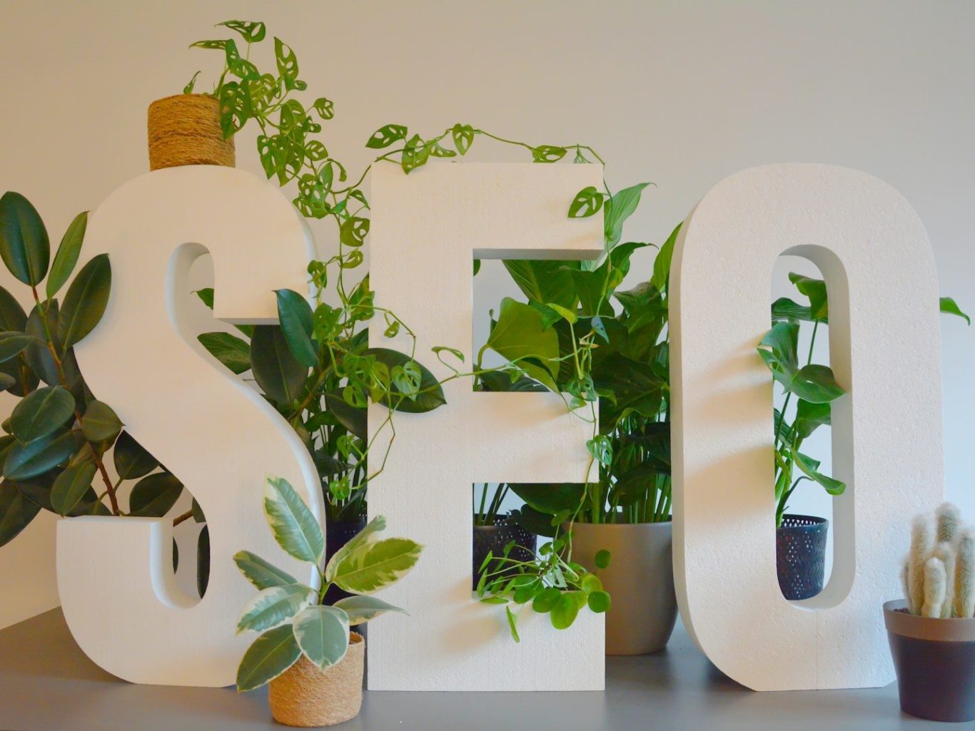 Colourful, textured letters spelling "SEO" in various patterns.